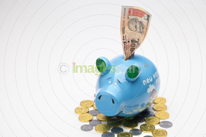 piggy bank with note and coins on white background 
