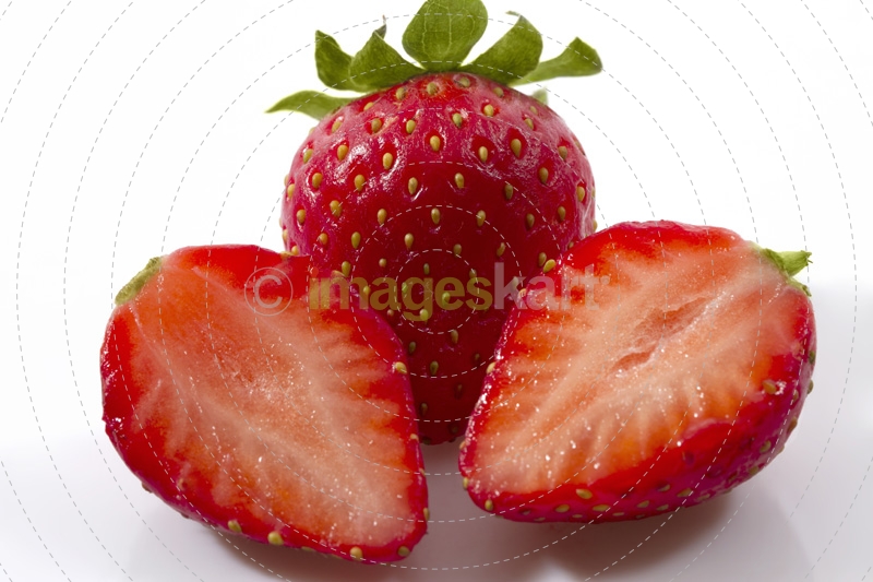 sliced strawberry against white background