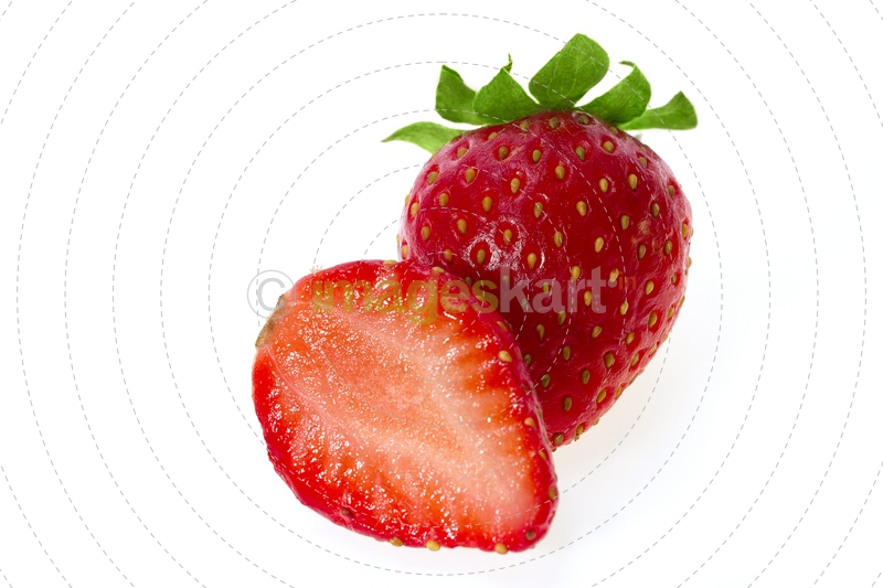sliced strawberry on display against white background 