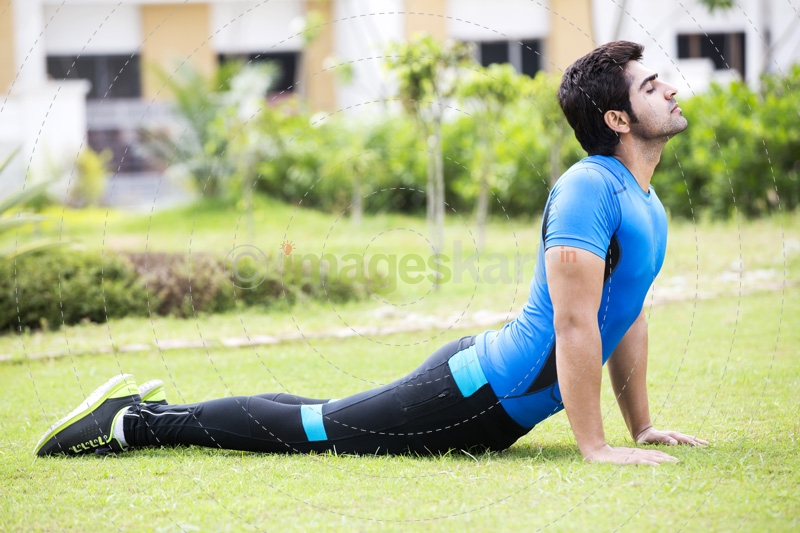 man doing exercise in park