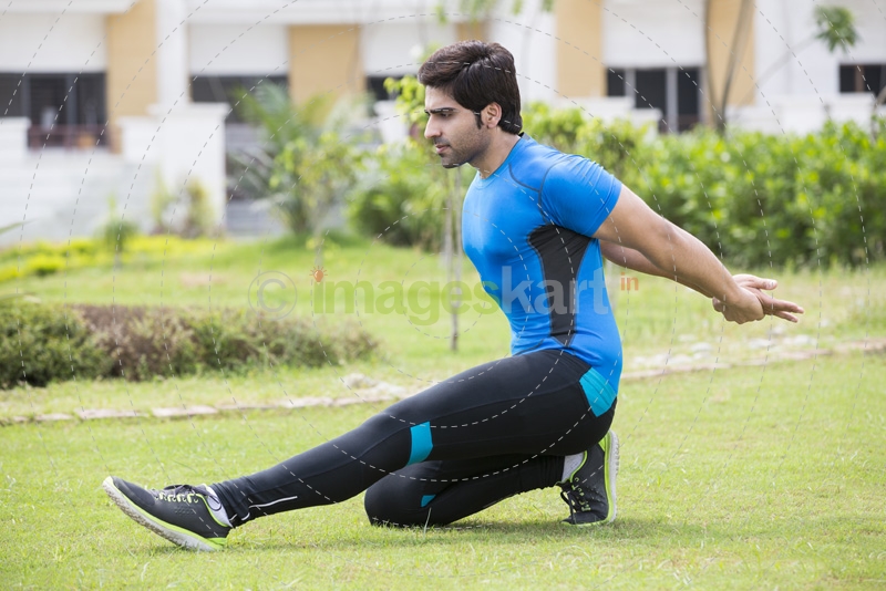 young man in park exercising 