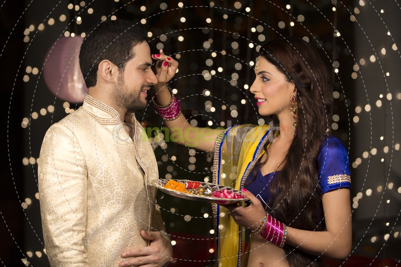 couple celebrating diwali at home 