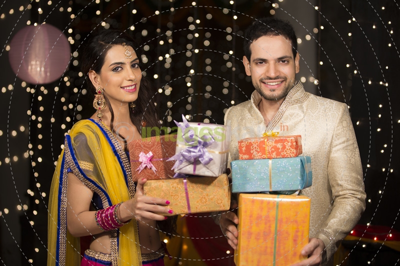 couple with diwali gifts  