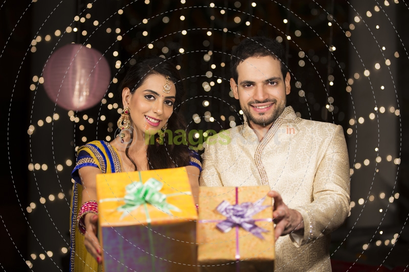 couple showing off their diwali gifts