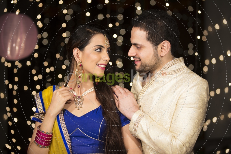 husband gifting necklace to his wife on diwali 