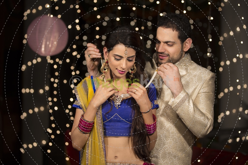 husband gifting necklace to his wife on diwali 