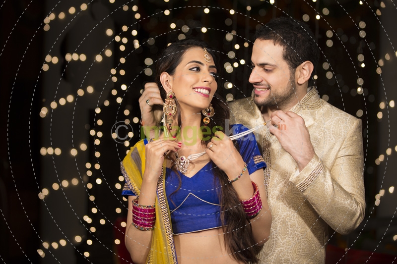 husband gifting necklace to his wife on diwali 