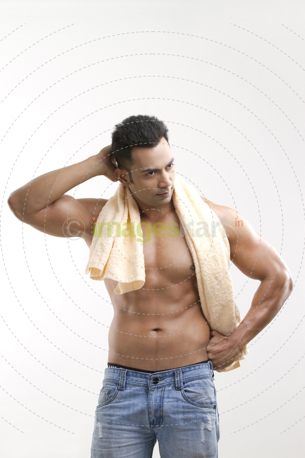 man posing with a towel