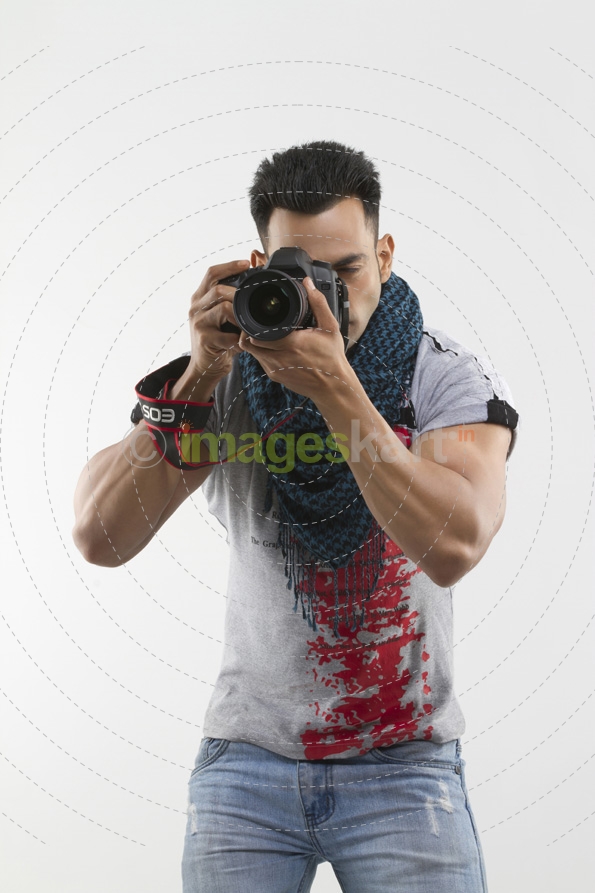 portrait of a well-built man taking pictures