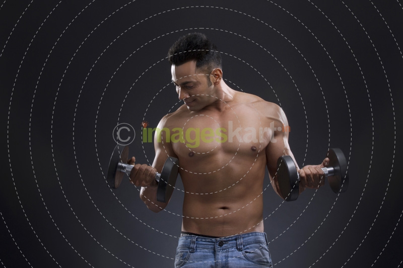 portrait of muscular man against a blue background