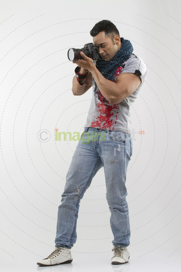 portrait of a well-built man taking pictures