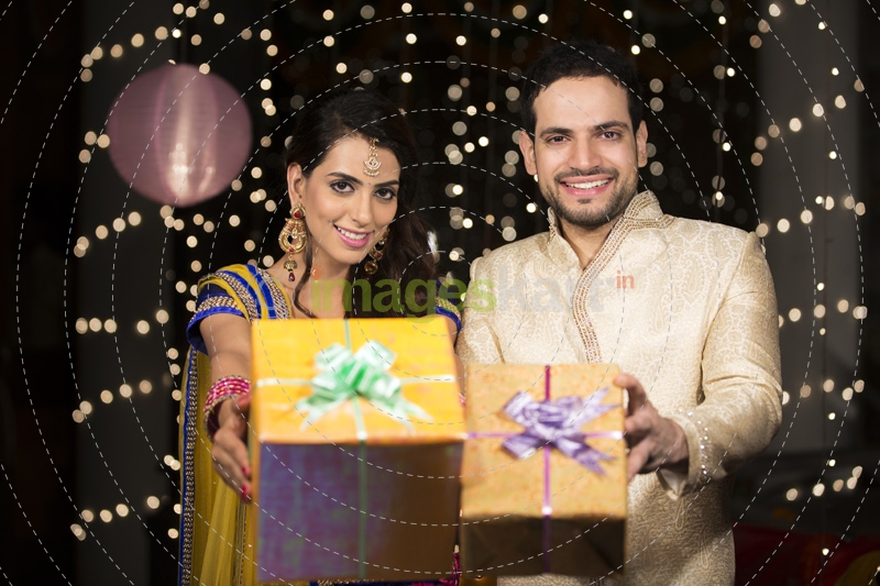 couple with diwali gifts  
