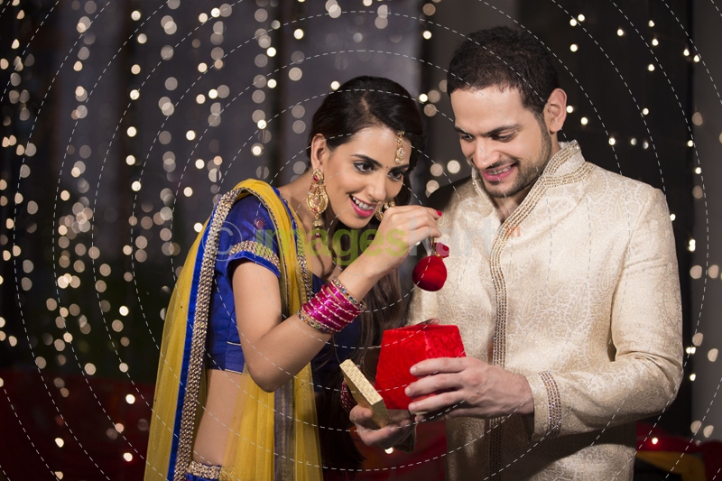 husband giving surprise to wife