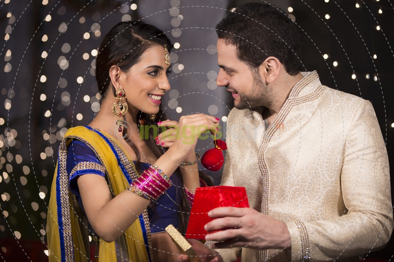 husband giving surprise to wife