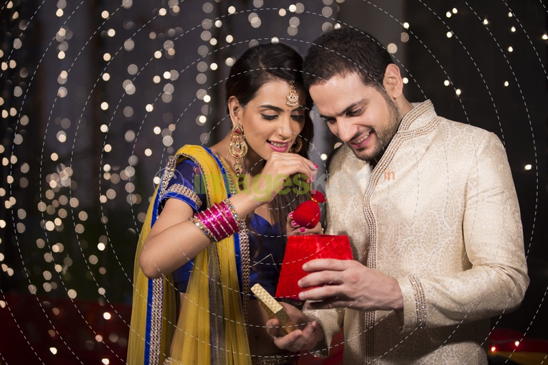 husband giving surprise to wife