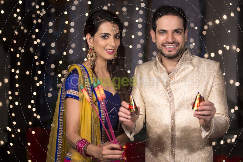 couple with crackers on diwali 