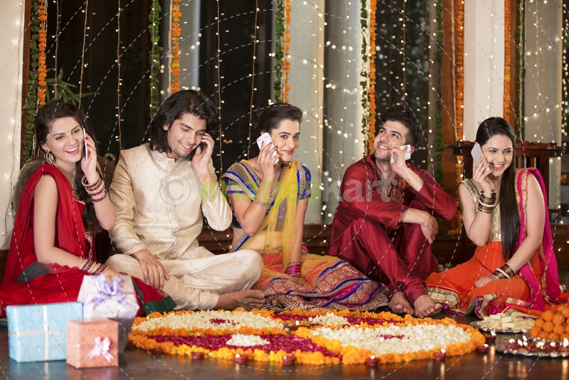friends on diwali busy talking on the phone