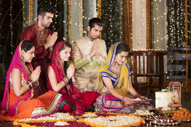 couples doing diwali pooja