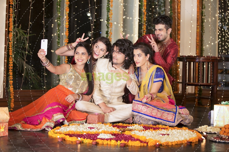 group of friends clicking photographs on festival