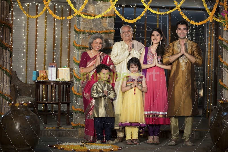 family standing at entrance gate to welcome
