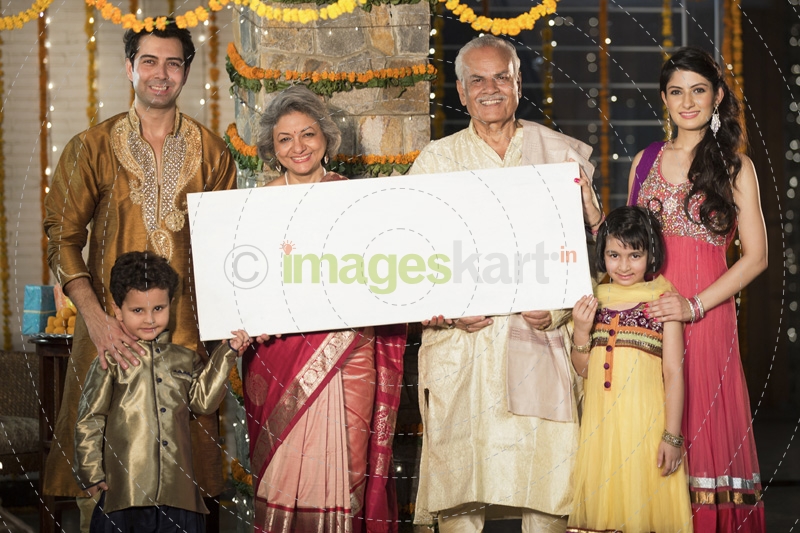 family standing at entrance with message board on diwali
