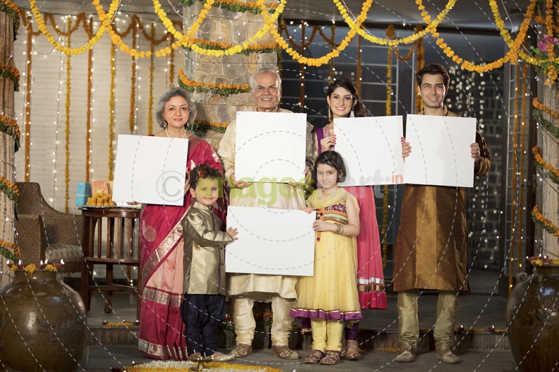 family standing at entrance with message boards on diwali