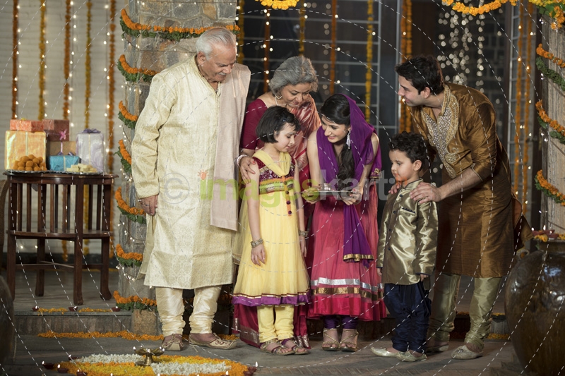 family doing diwali pooja 