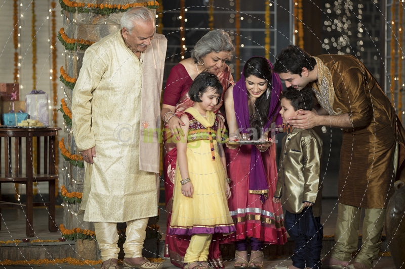 family doing diwali pooja 
