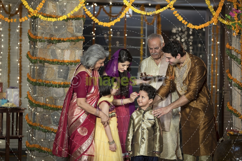 family doing diwali pooja 