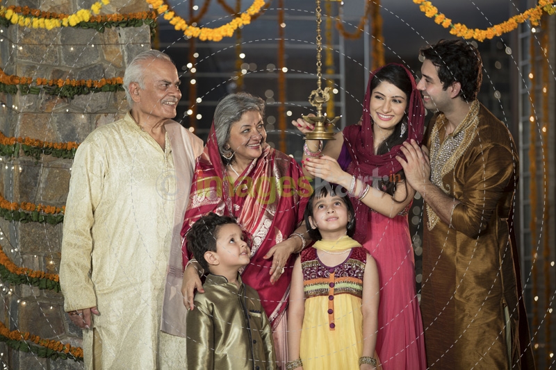 family doing diwali pooja 