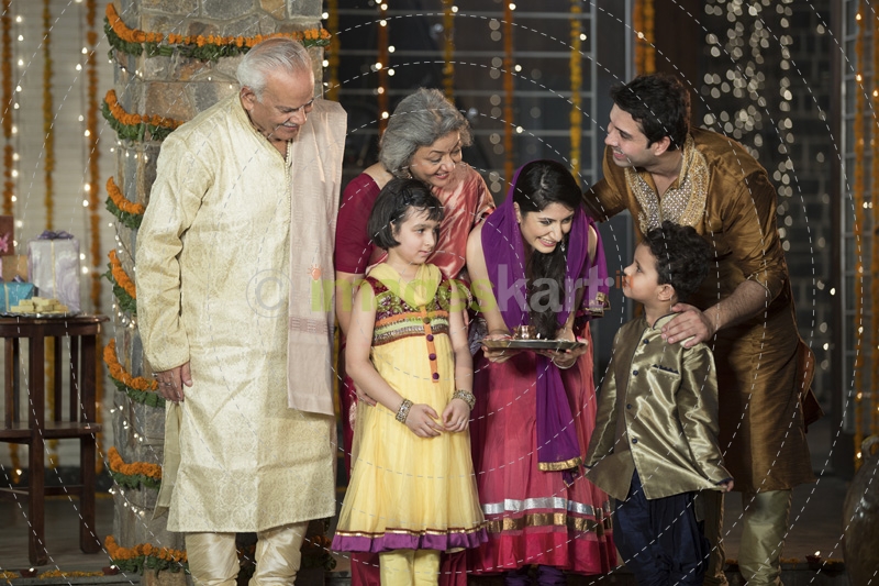 family doing diwali pooja 