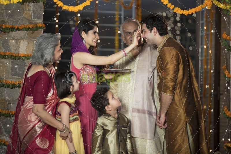 family doing diwali pooja 