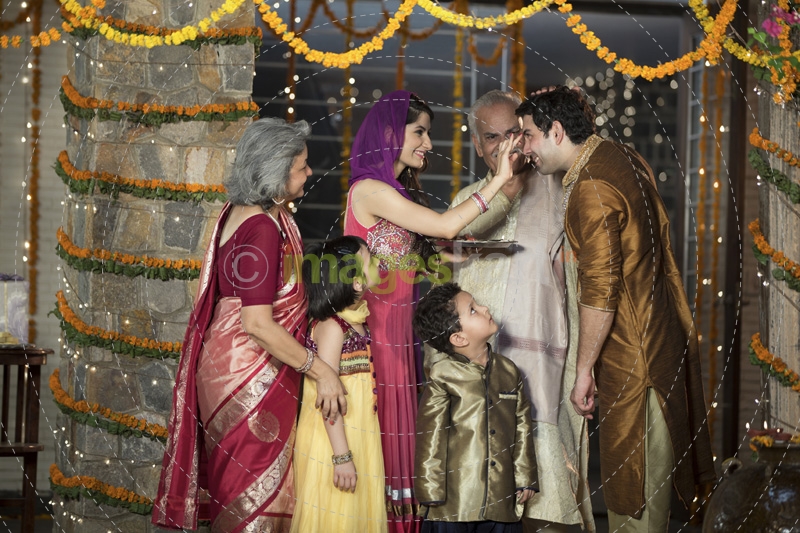 family doing diwali pooja 