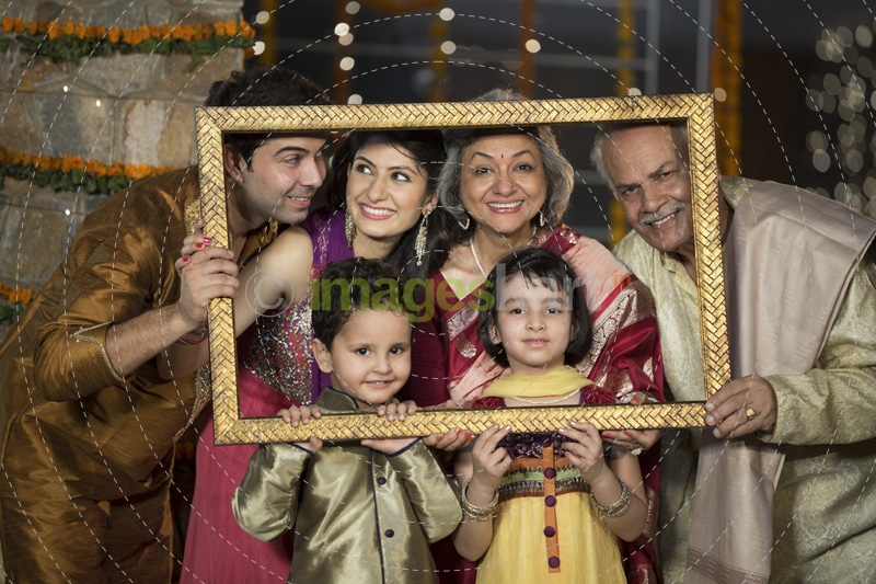 traditional indian famil in a picture frame