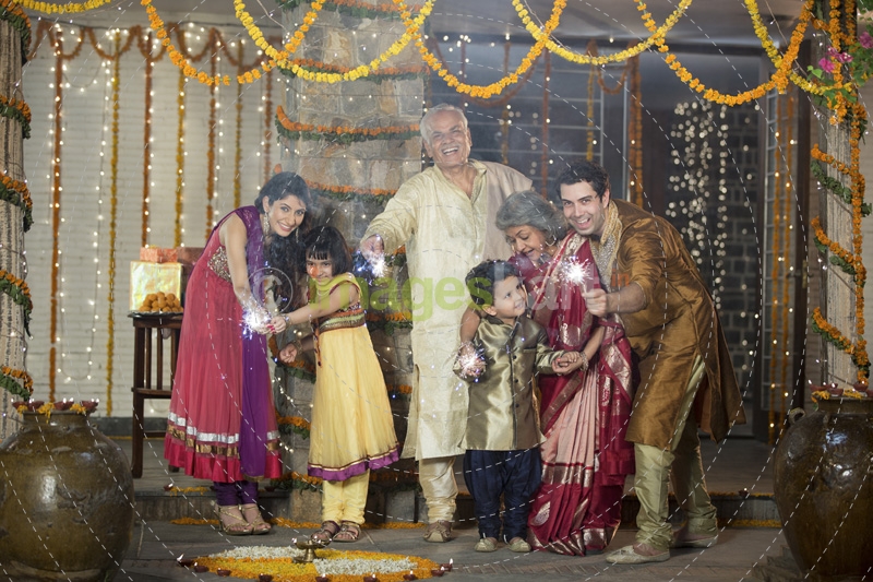 family celebrating diwali with crackers 