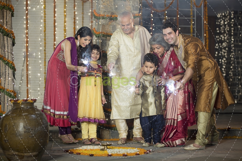 family celebrating diwali with crackers 