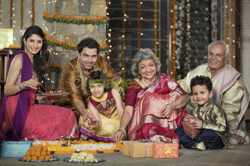 family celebrating diwali and doing pooja