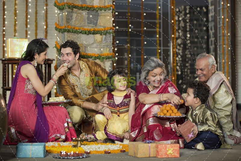 family celebrating diwali and doing pooja