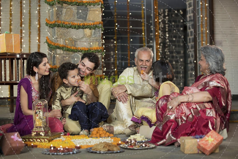  family celebrating diwali together 