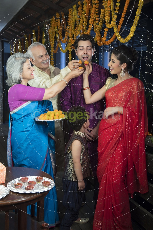 traditional family celebrating diwali