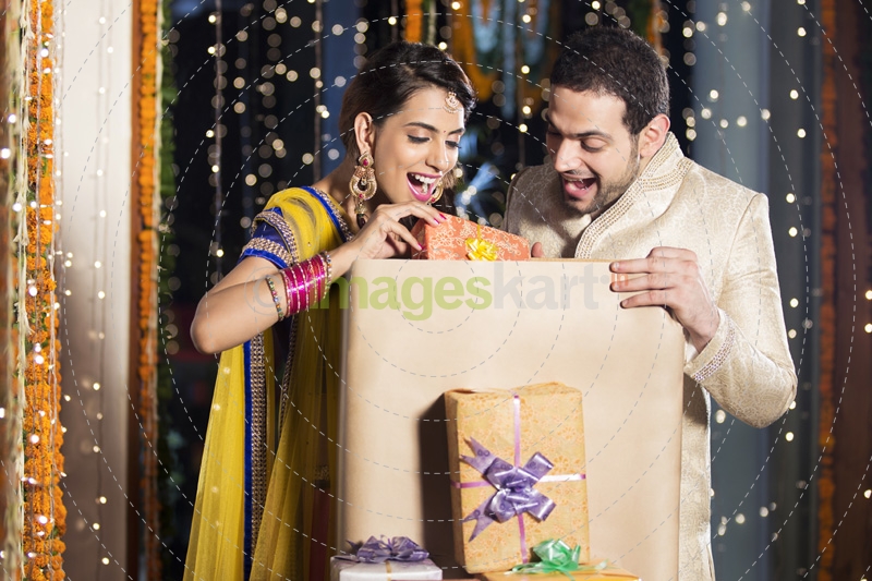 couple opening diwali presents 