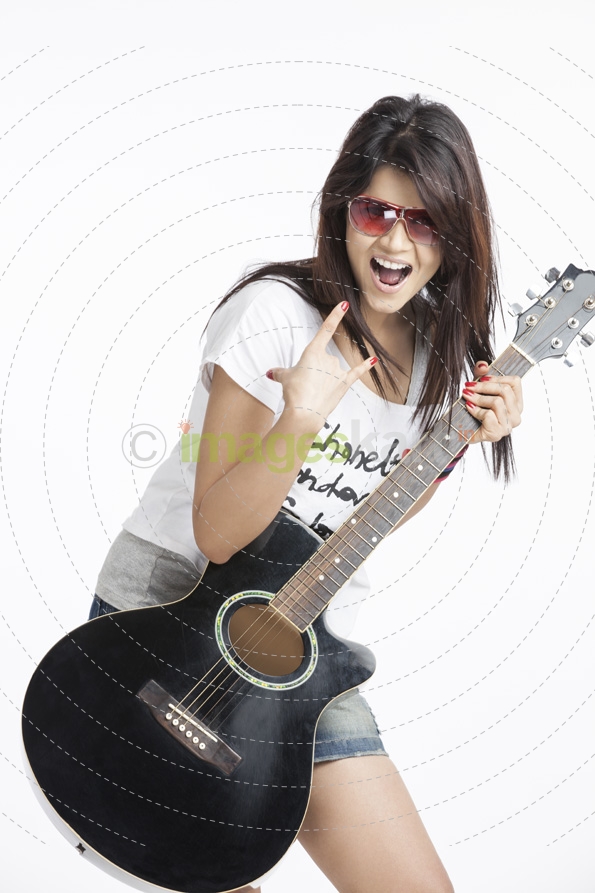 beautiful teenager playing guitar on white background