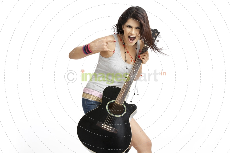 teenager in cool casual clothing with a guitar