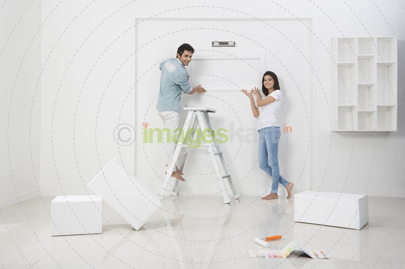 newly wed couple decorating their new home