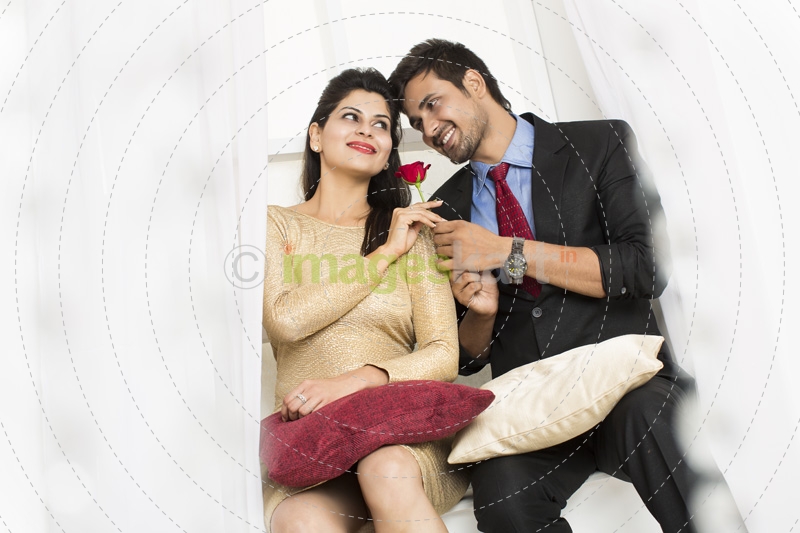 man giving rose to girl 