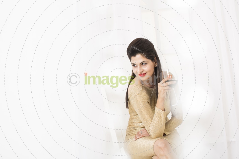 glamorous girl posing with wine glass 