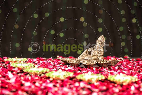 lord ganesha idol and diya stand 