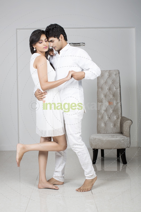 couple in white dress dancing and romancing 