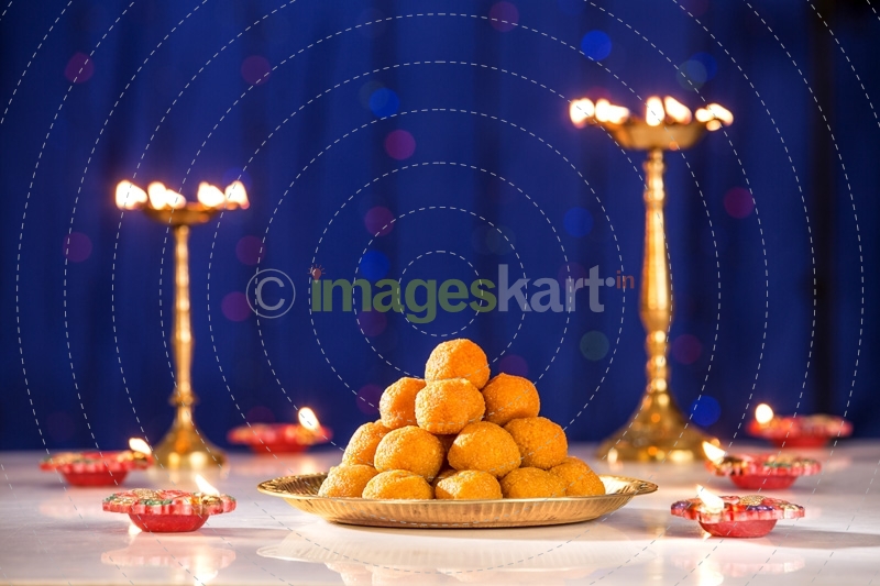 lighting lamps and ladoo on diwali 
