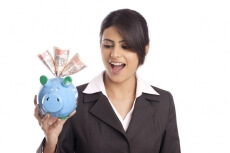 businesswoman with piggy bank and cash